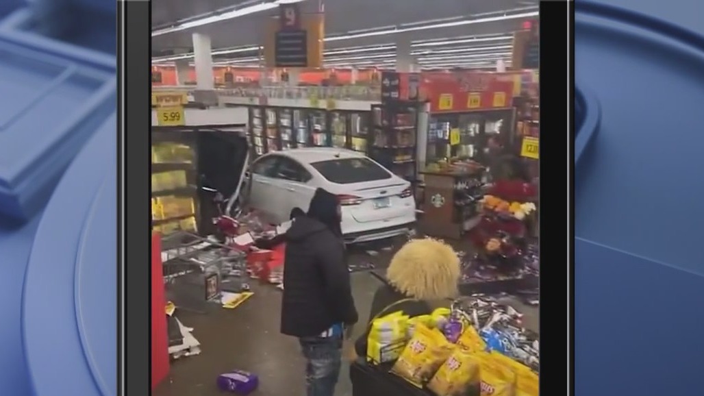 Car plows into suburban grocery store