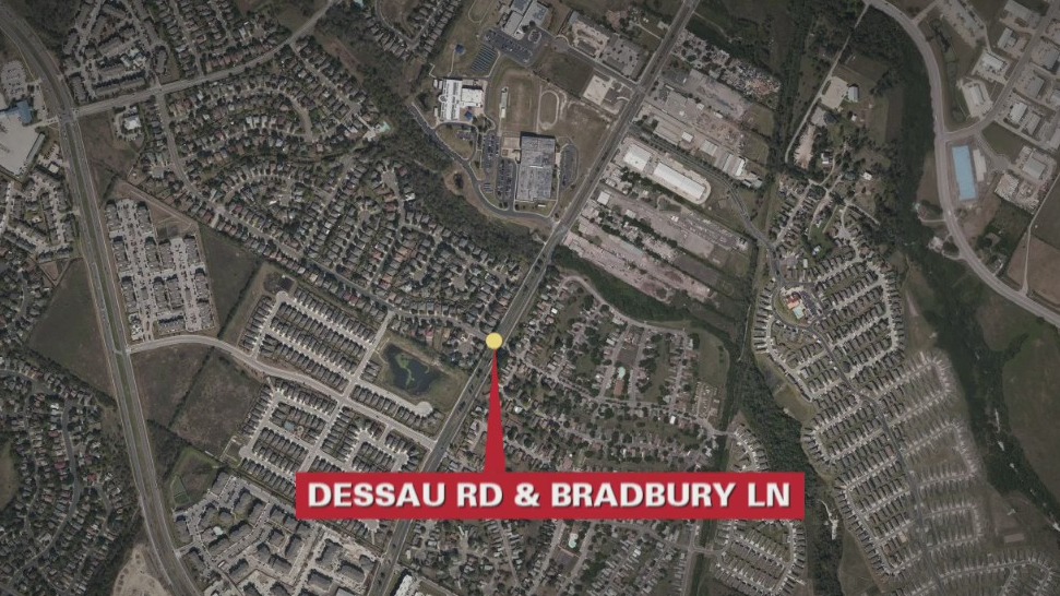 1 person hospitalized after vehicle pinned under bus