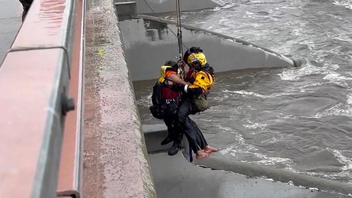 Firefighters rescue man swept away in Santa Ana River