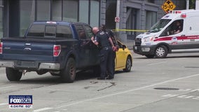 Woman killed in Seattle crash involving taxi, truck