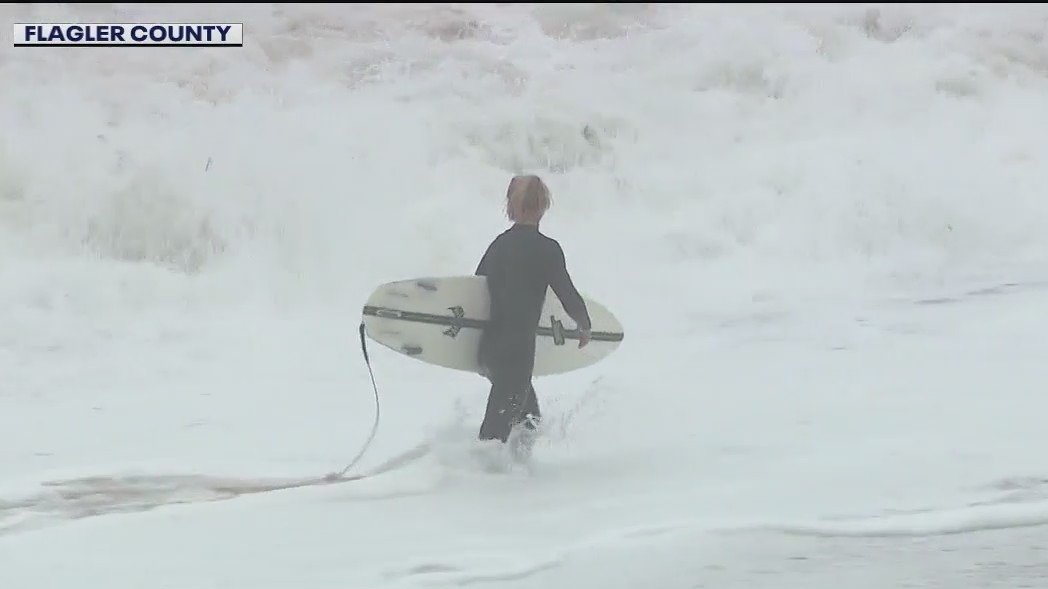 Surfers catch waves as conditions worsen