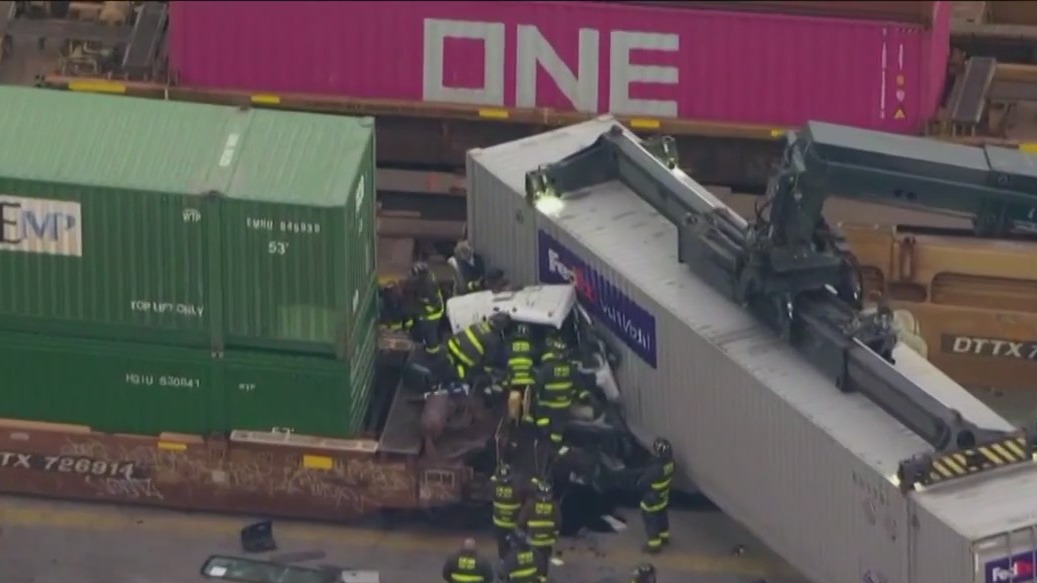 Truck driver trapped in crash that derailed two trains in Fuller Park railyard