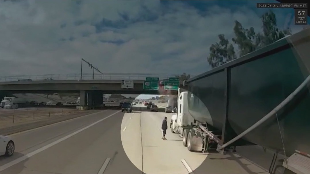 Man who darted in between traffic on I-10 arrested, officials say
