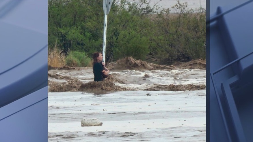 Woman clinging to stop sign rescued from Arizona flooding