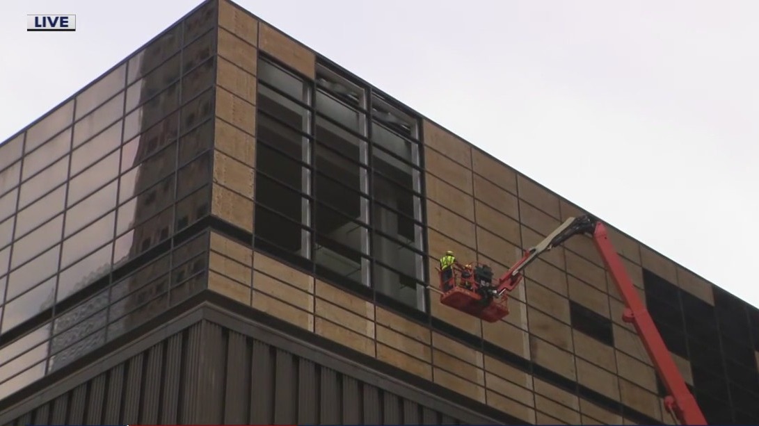 Downtown Houston streets remain closed as crews clear falling glass after last week's storm