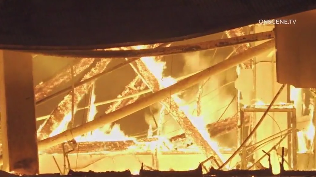 Massive fire rips thru historic Tustin hangar