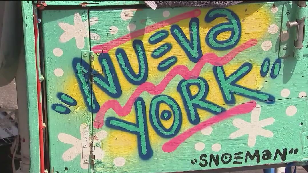 Mystery artist decorating storefronts