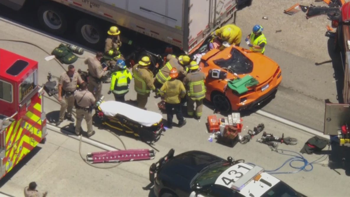 Corvette crashes into semi-truck