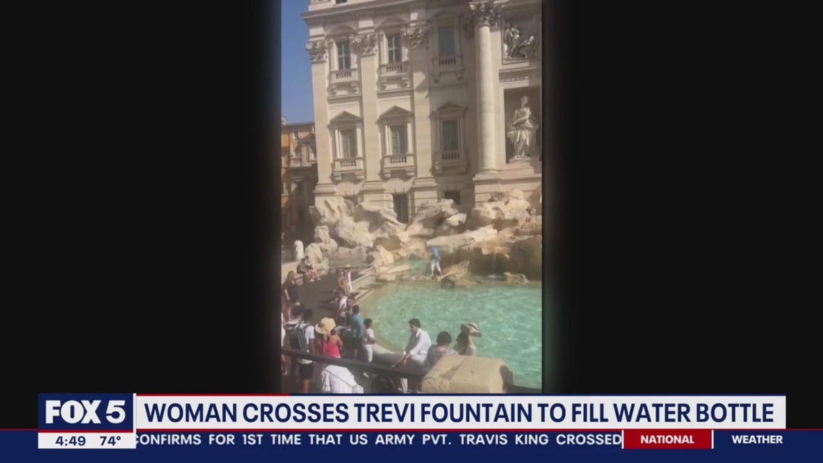 Woman caught on camera wading through Rome ‘s Trevi Fountain to fill water bottle