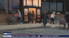 Snow storm has grocery stores jammed with last-minute shoppers