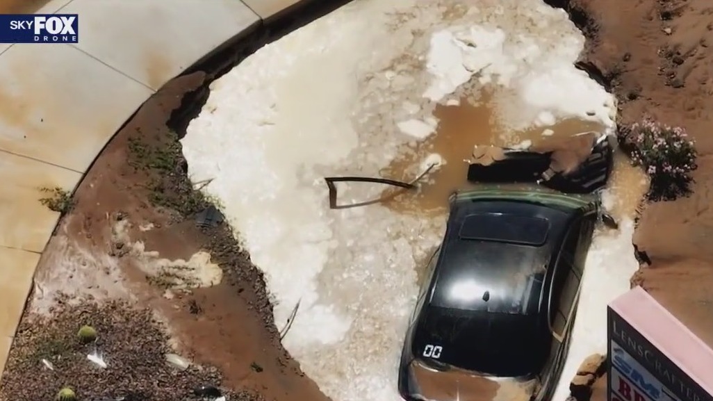 Car swallowed by muddy sinkhole in Phoenix
