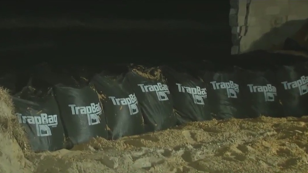 Crews, residents race to put up temporary sea walls in Daytona Beach Shores