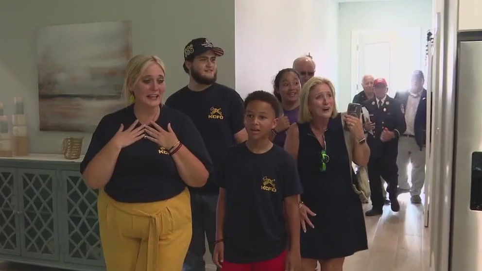 Fallen firefighter's family gets new home