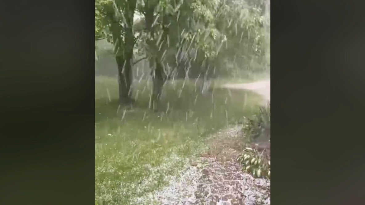Hail pours down onto Livingston County home