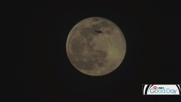 Wisconsin photographer captures moon and plane perfectly aligned