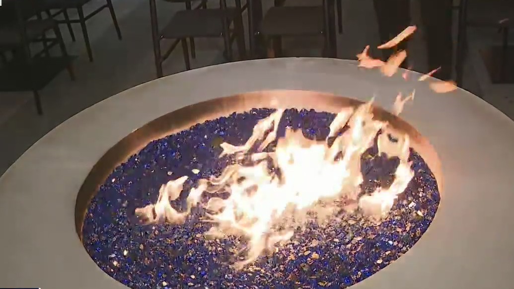 Cozy up to the fire pit at Colony Square's Saints + Council
