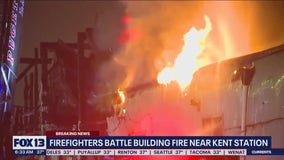 Firefighters battling large building fire near Kent Station
