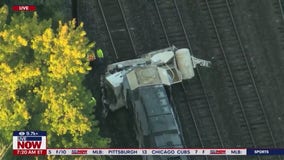 Cement truck collides with freight train