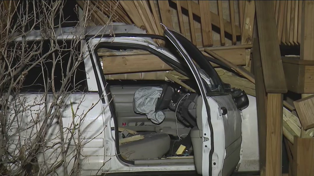 Woman killed after crashing vehicle into porch of home