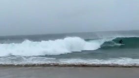 Surfers hit dangerous waves during Tropical Storm Hilary