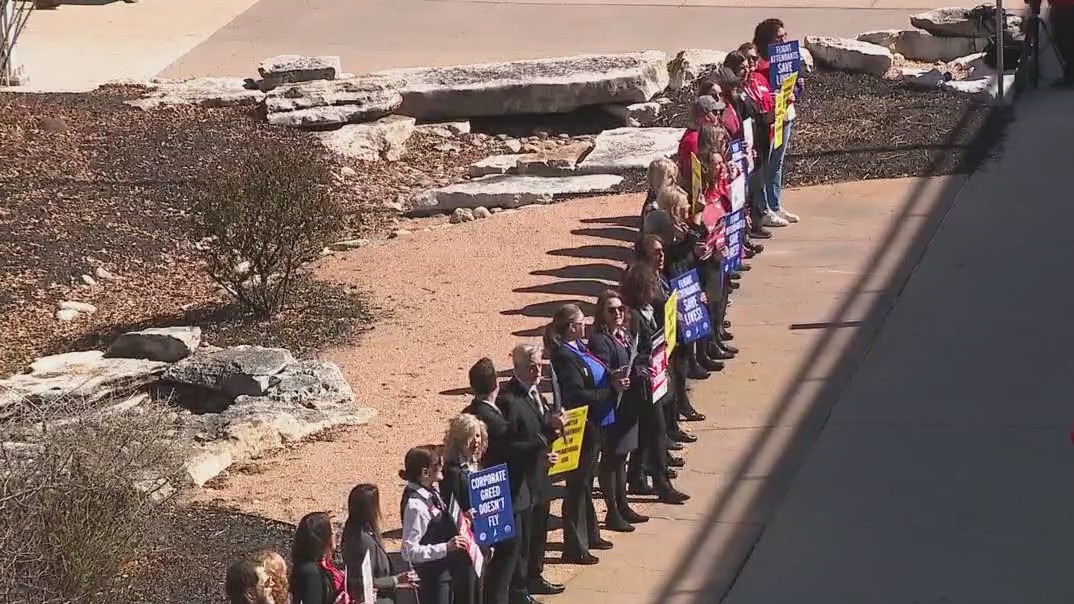 Dozens of flight attendants picket outside Austin airport