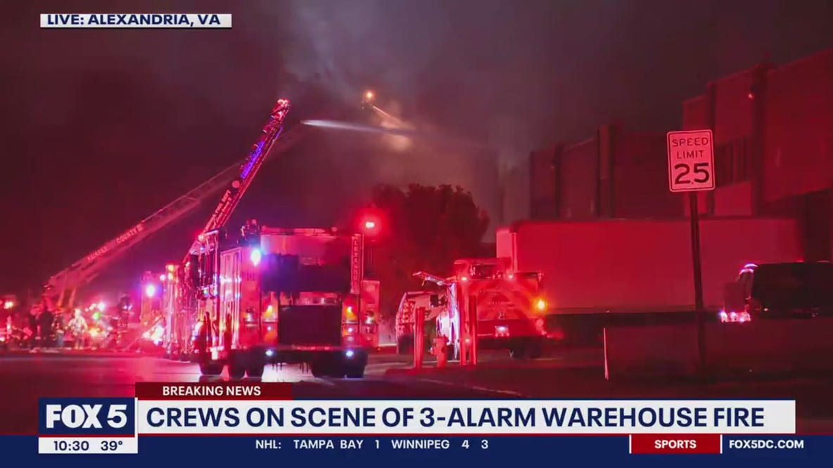 Fire crews battle warehouse fire in Alexandria