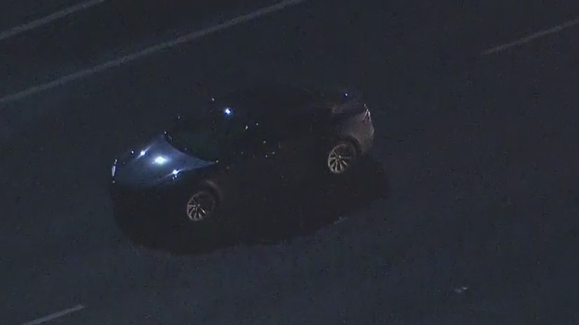 Police chase: Standoff underway between CHP, possible stolen Tesla in Orange County