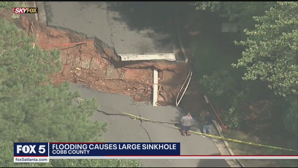 Flooding causes large sink hole in Cobb County
