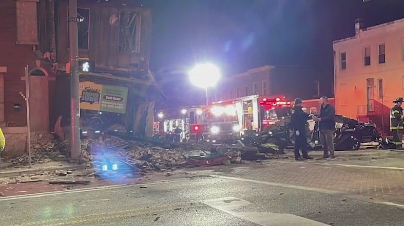 1 dead, several hurt after cars crash into Baltimore building causing it to collapse