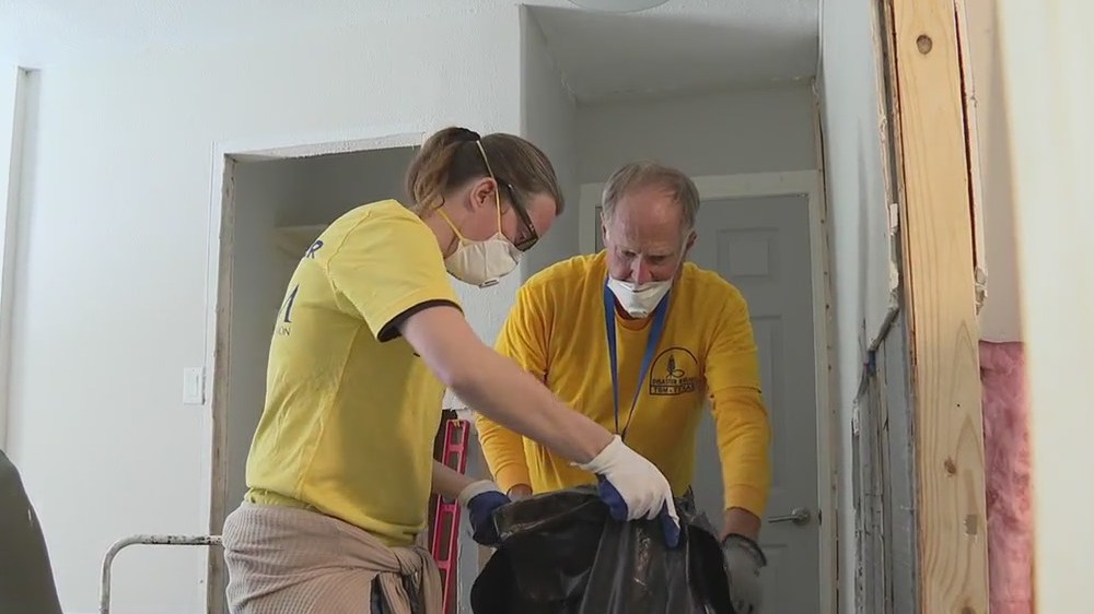 Volunteers clean up flooded homes in Conroe