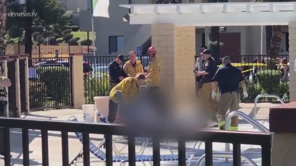 Man, teen, shot dead by apartment pool