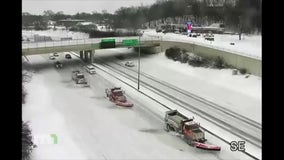 Triple snowplows clearing highway