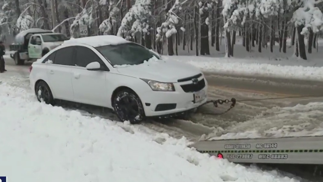 Cars getting stuck on the roads as snow continues to blanket Chicagoland