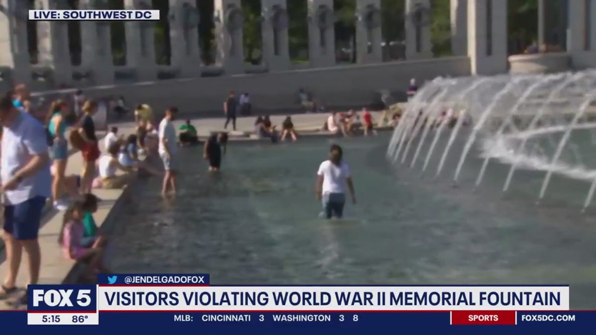 Visitors seen breaking rules at WWII Memorial Fountain, wading in water