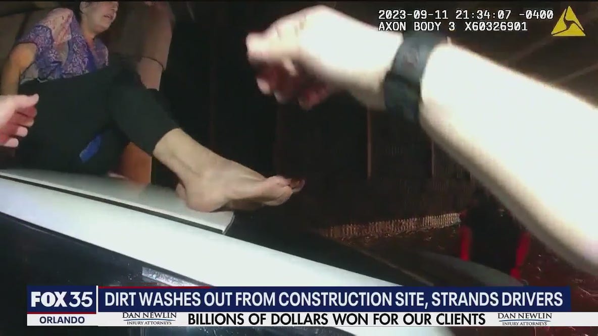 Drivers rescued after mud washes onto road