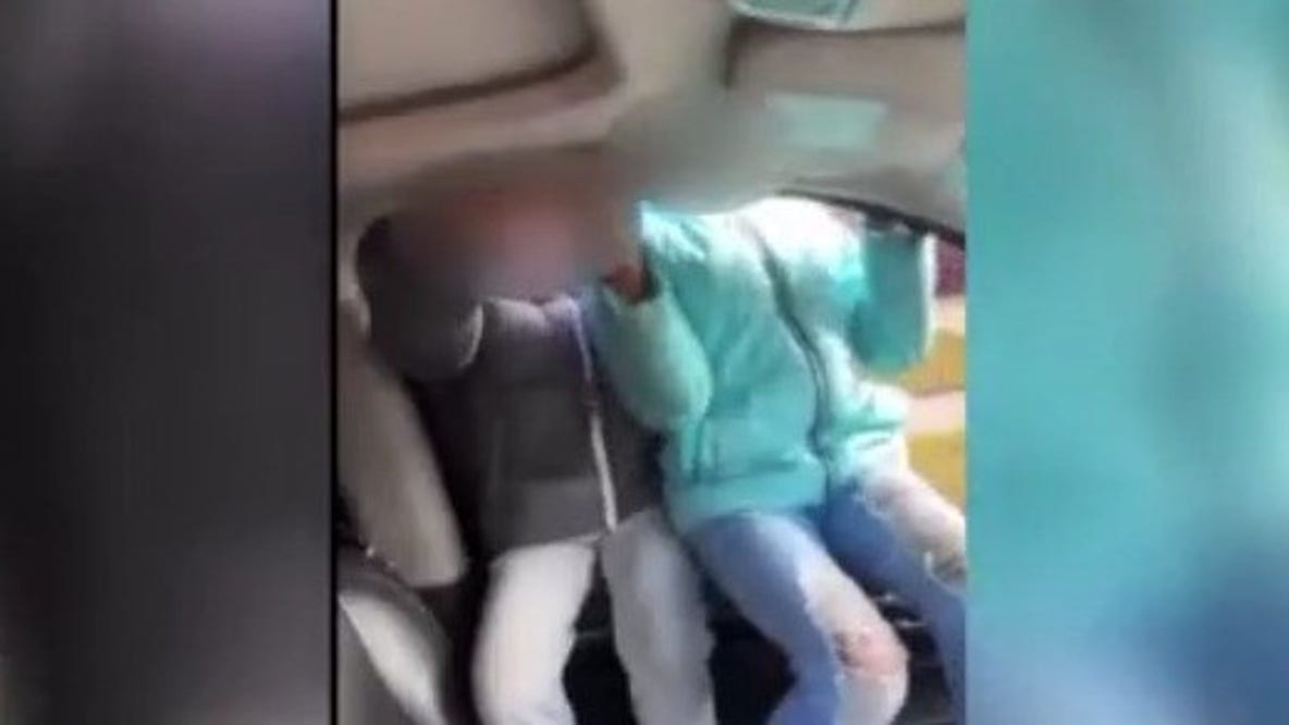 Woman goes viral for video of kids hanging out of moving car