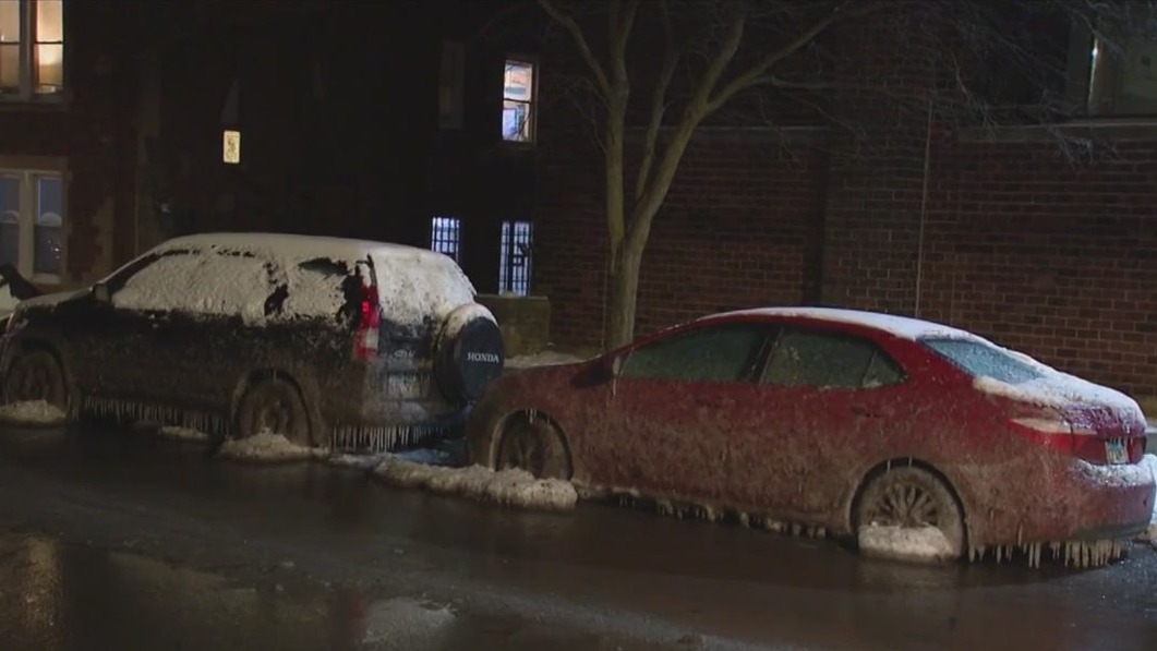 Cars stuck in ice after residential service line bursts
