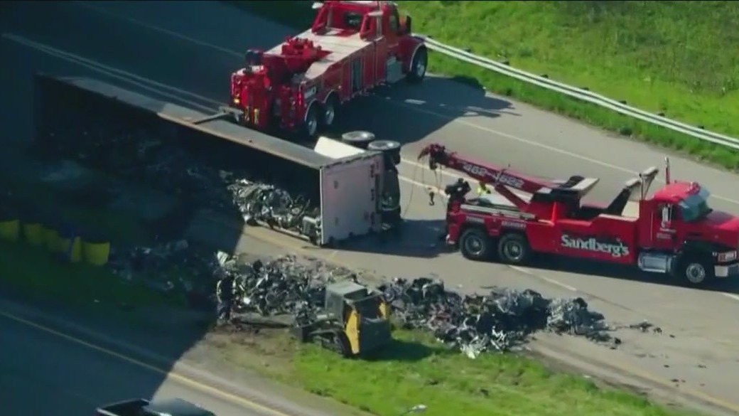Scrap metal truck overturns on Indiana highway