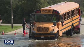 Elm Grove flooding; school bus stranded in water