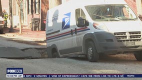 Sinkhole nearly swallows postal van as residents evacuate in Wilmington