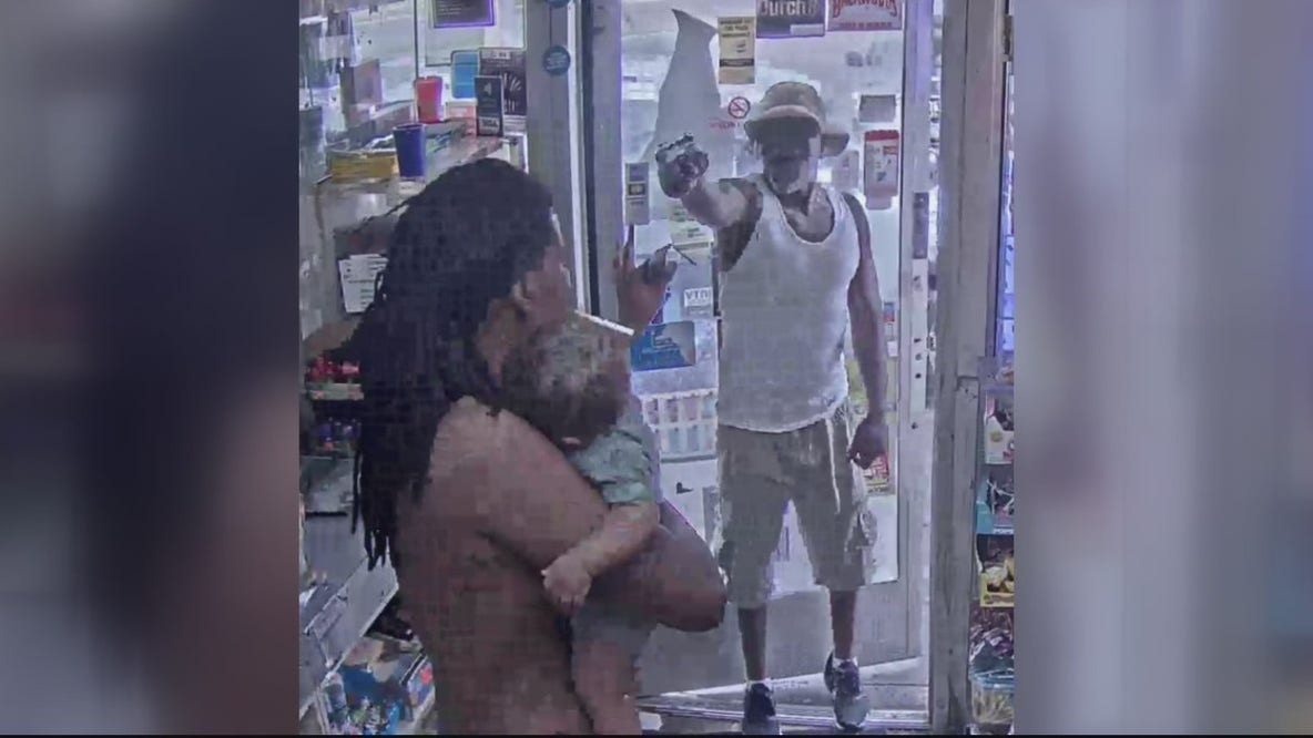 Suspect arrested after pulling gun on man holding child inside Detroit gas station