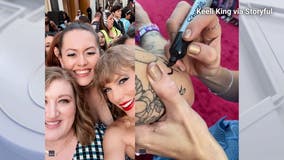 Taylor Swift signs fan's tattoo in LA