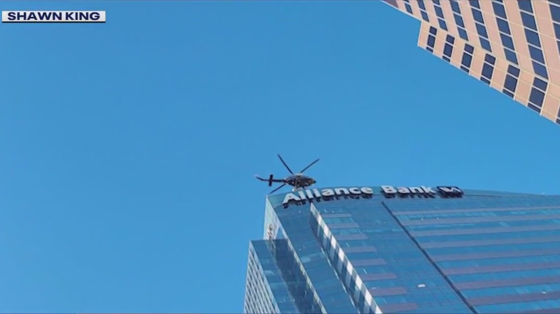 Helicopter makes low-level flight over Downtown Phoenix ahead of Super Bowl