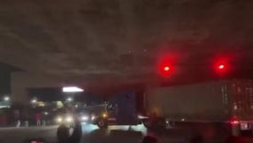 Oakland sideshow crowd cheers big rig driver