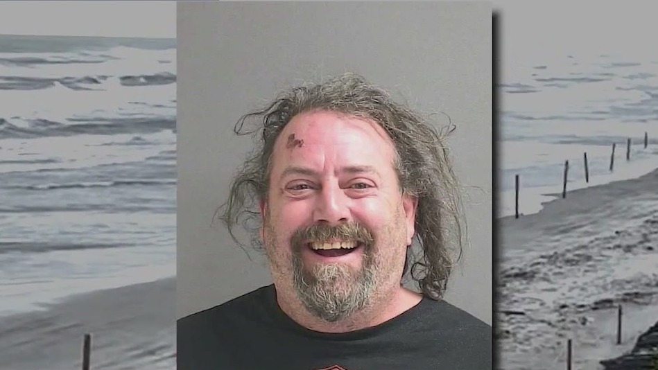 Man arrested after driving pickup truck into ocean