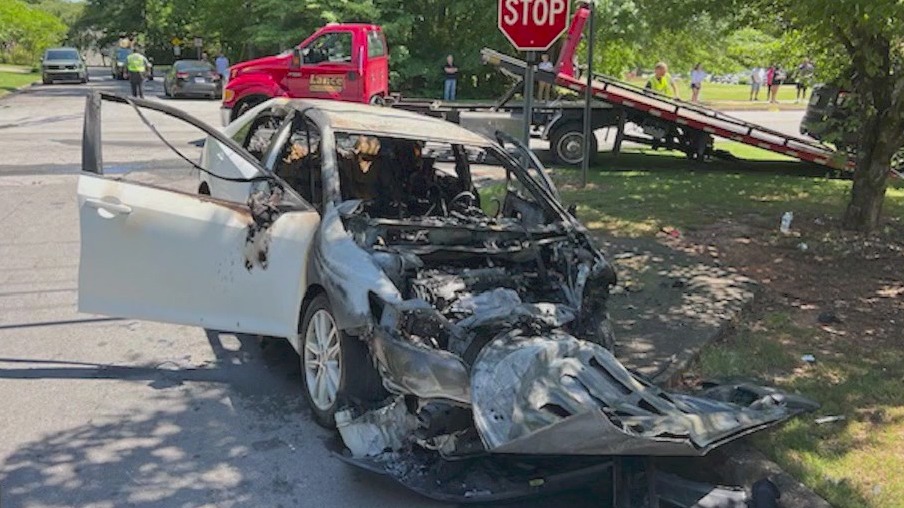 FedEx driver rescues pregnant woman from burning car
