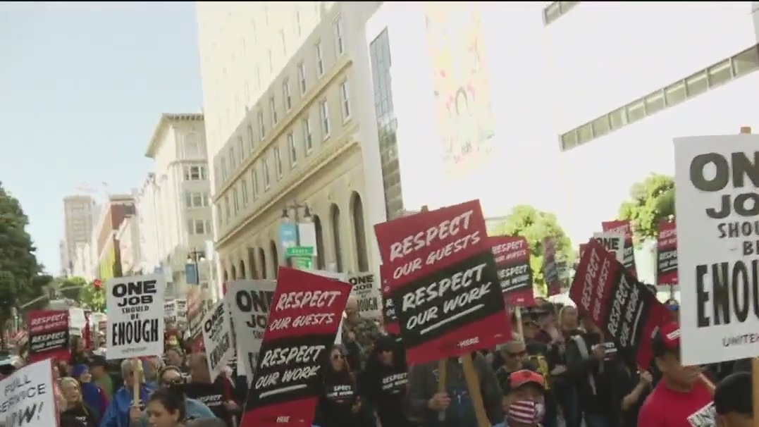 San Francisco hotel workers and janitors march on May Day for better pay, healthcare