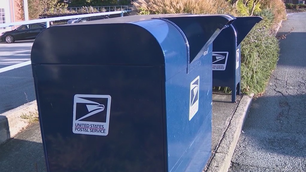 Postal worker caught on camera using proceeds of mail stolen from suburban post office