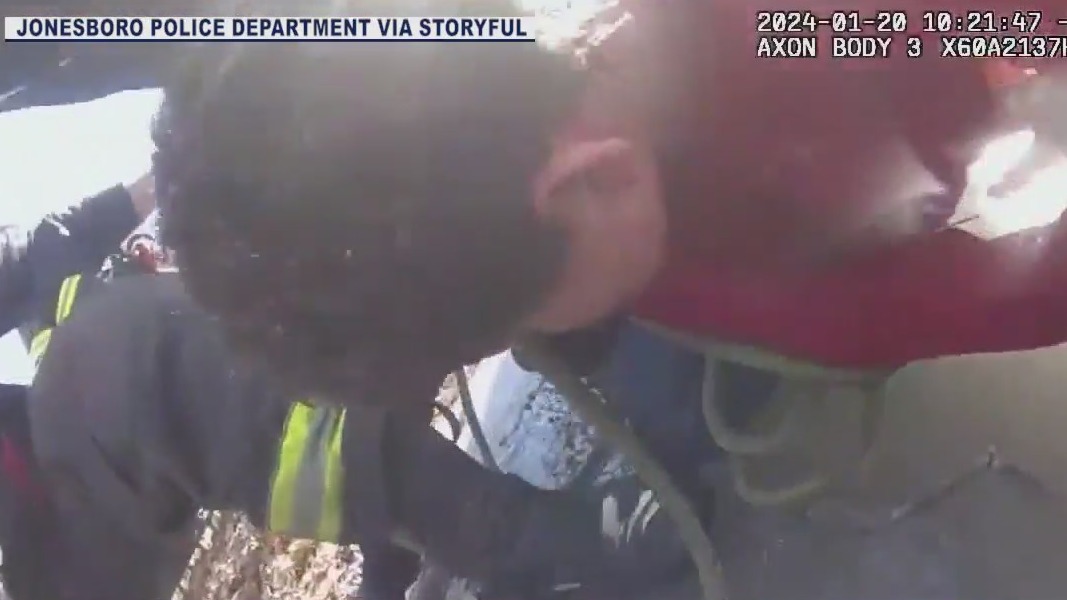Officer pulls child out of frozen pond