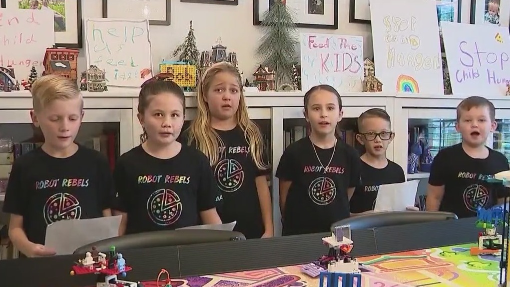 Kids create, code robots using Legos